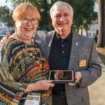 faculty members with plaque