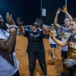 student athletes cheering on field