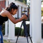 student with a camera