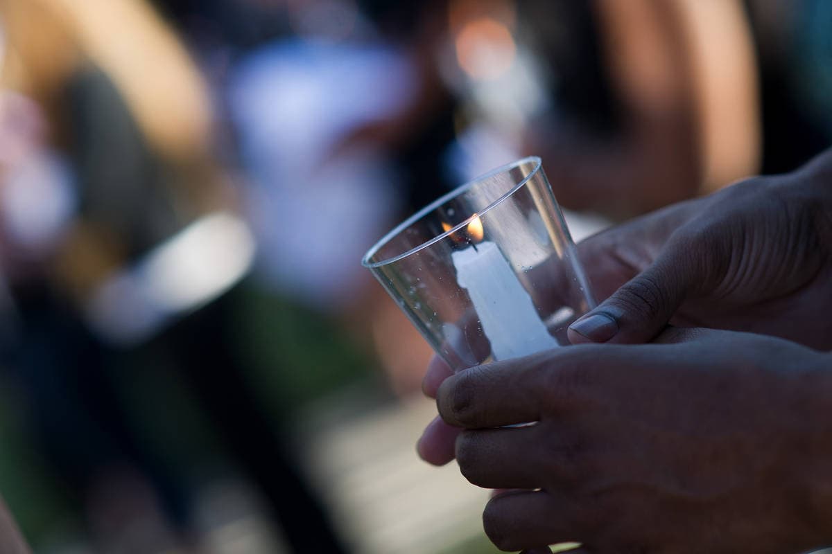 A participant holds a candle during the Vigil for Lives Lost. (AJ Reynolds/Brenau University)
