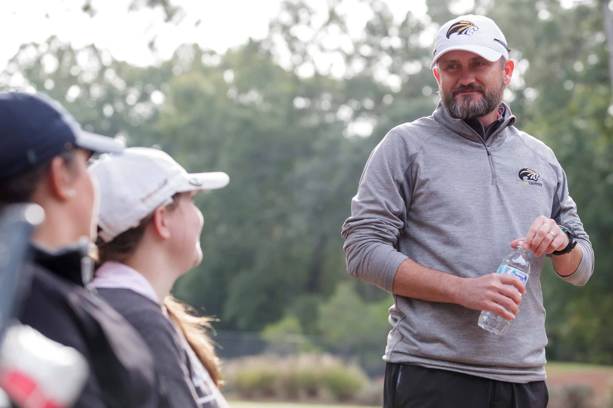 Brenau head coach Damon Stancil talks with Brenau's Amber Clayton, a senior from Lawrenceville, Ga. and Brenau's Annika Blanton, a sophomore from Hoschton, Ga. during the Berry Invitational on Tuesday, Oct. 24, 2018 in Rome, Ga. (AJ Reynolds/Brenau University)