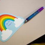 rainbow post it note with a message