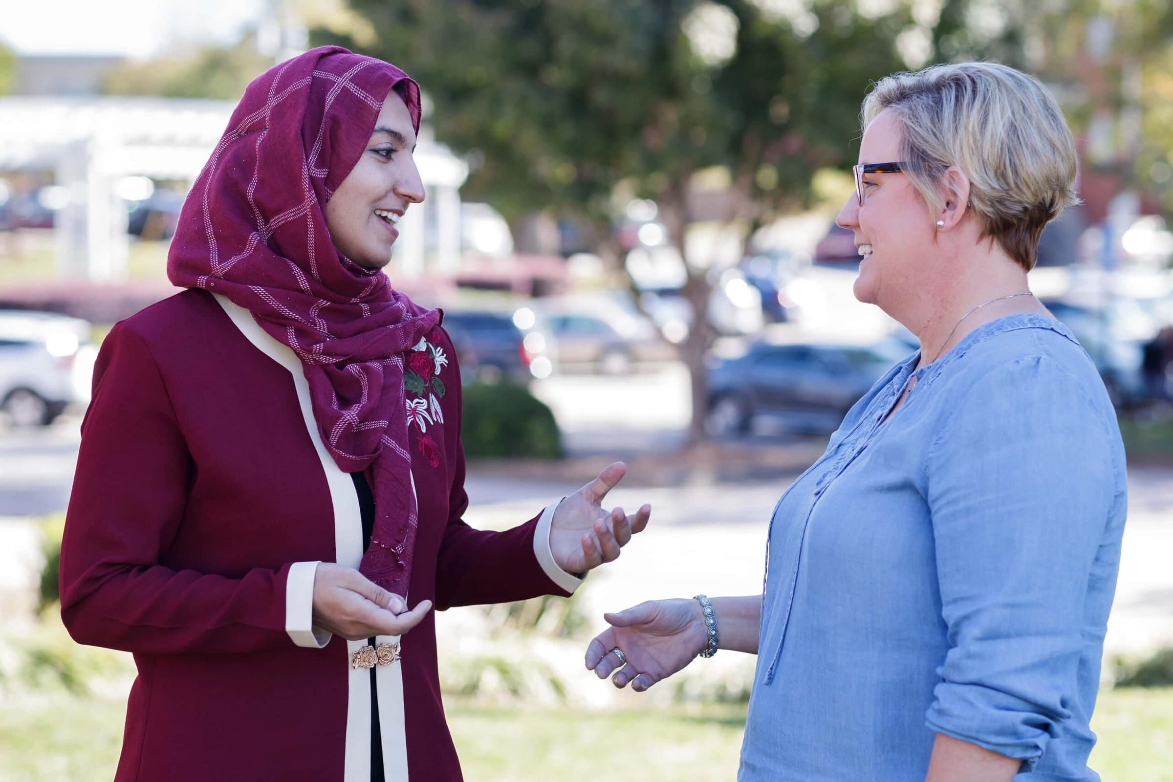 Maryem, a Women's College alumna from Afghanistan, speaks with Tami English on campus. (AJ Reynolds/Brenau University)