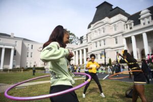 Students participating in outside games on front lawn