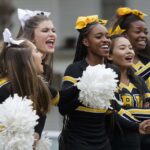 Students on the cheer team following Convocation.