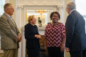 From left to right: Gary Lee, Lucy Lee, Kia Shields, a senior early childhood education major, and Brenau President Ed Schrader. Shields received the prestigious Gary Lee Scholarship from the Council of Independent Colleges. (AJ Reynolds/Brenau University)