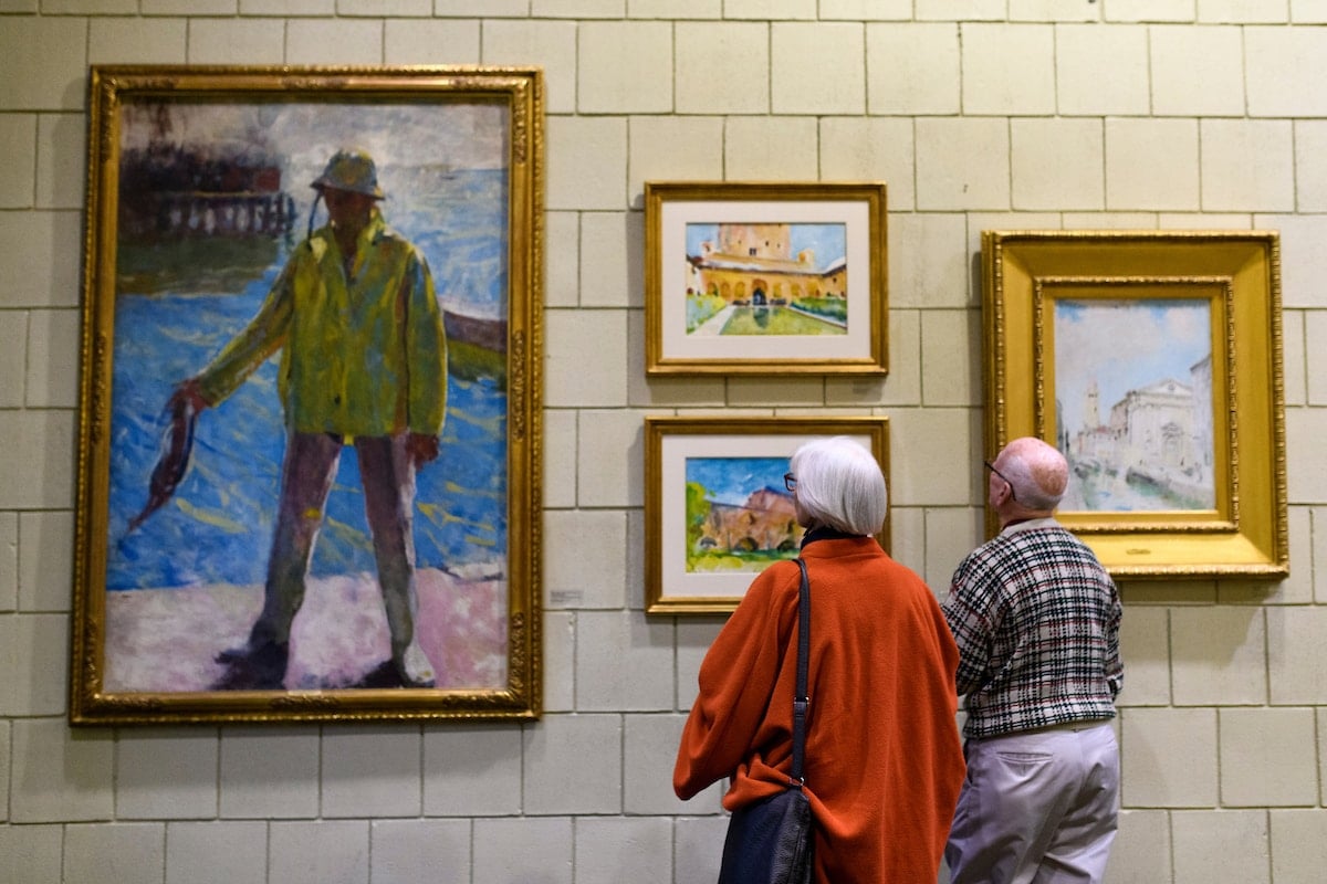 Guests view paintings on display