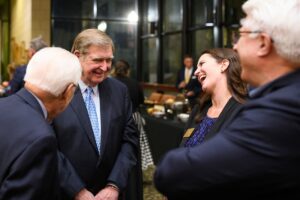 Brenau Trustee Doug Ivester laughs with Brenau Galleries Director Nichole Rawlings