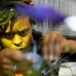 woman placing butterfly