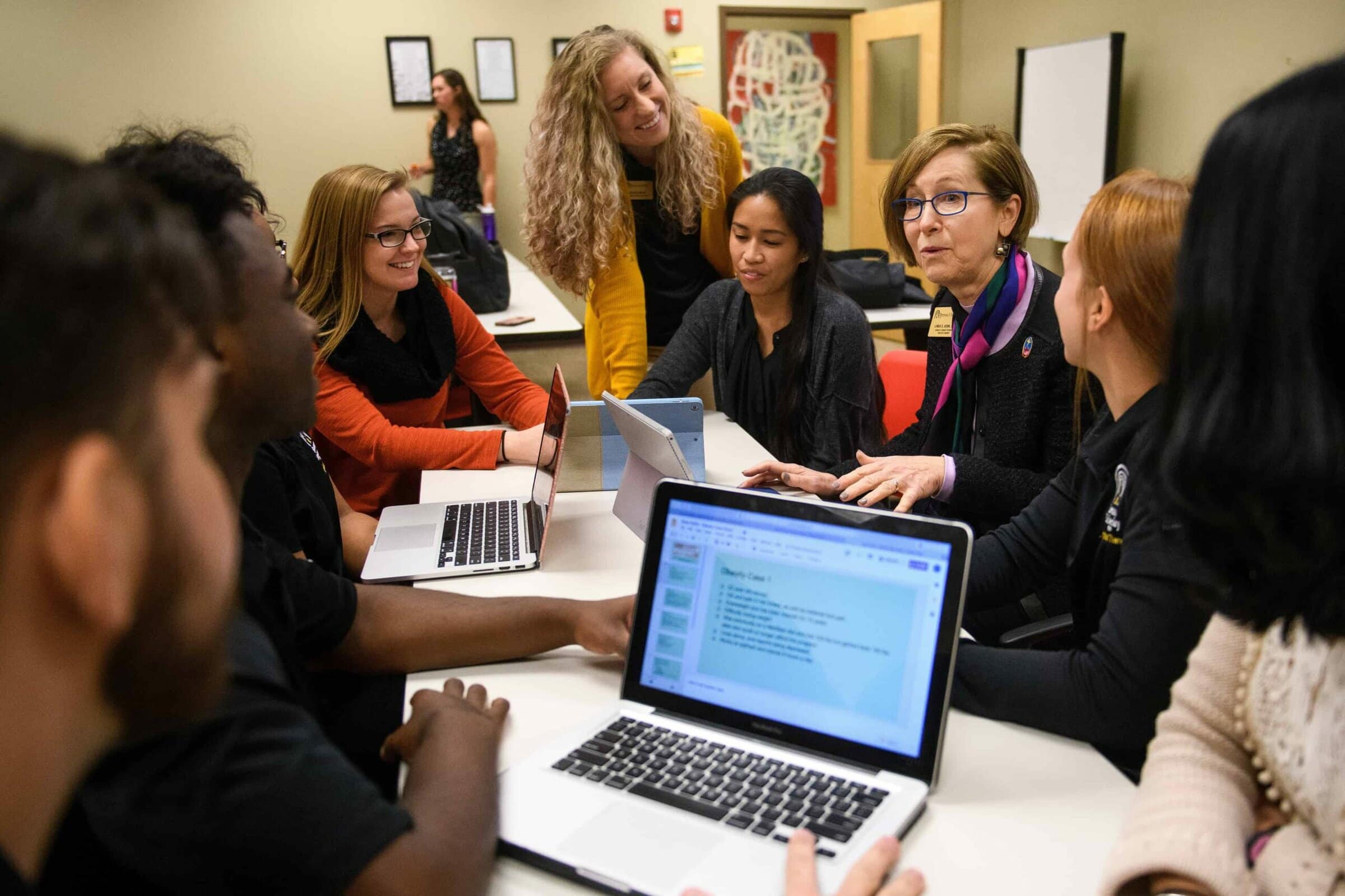 Linda Kern, dean of library sciences, talks with a group of physical therapy students about utilizing the library's resources in their research. (AJ Reynolds/Brenau University)