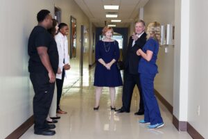 Kay Ivester, center, and Doug Ivester talk with health science students Martis Ferguson, Bethany Green, Chandy Henson and Savannah Blalock at a meet and greet during an event announcing the naming of the Brenau University Ivester College of Health Sciences. (AJ Reynolds/Brenau University)