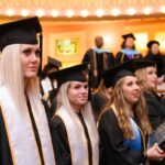 students standing in the audience