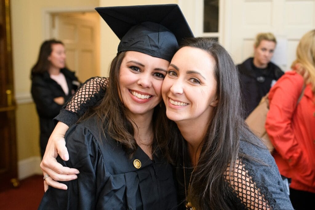 student hugs friend