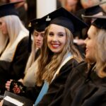 student smiling in the audience