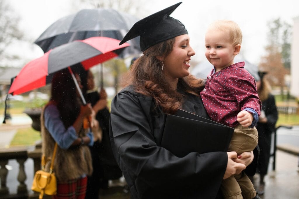 Gabrielle Wagner holds her son after the Brenau University Undergraduate Commencement ceremony on Friday, Dec. 14, 2018 in Gainesville, Ga. (AJ Reynolds/Brenau University)