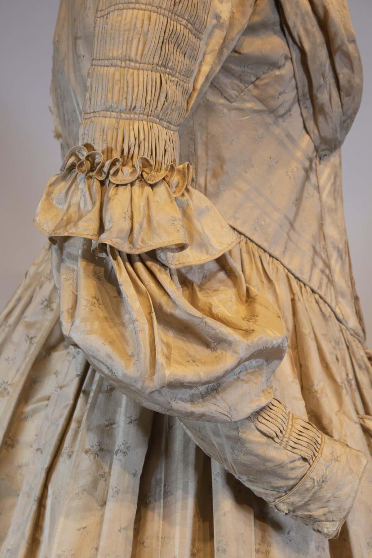 detail of silk fan front dress