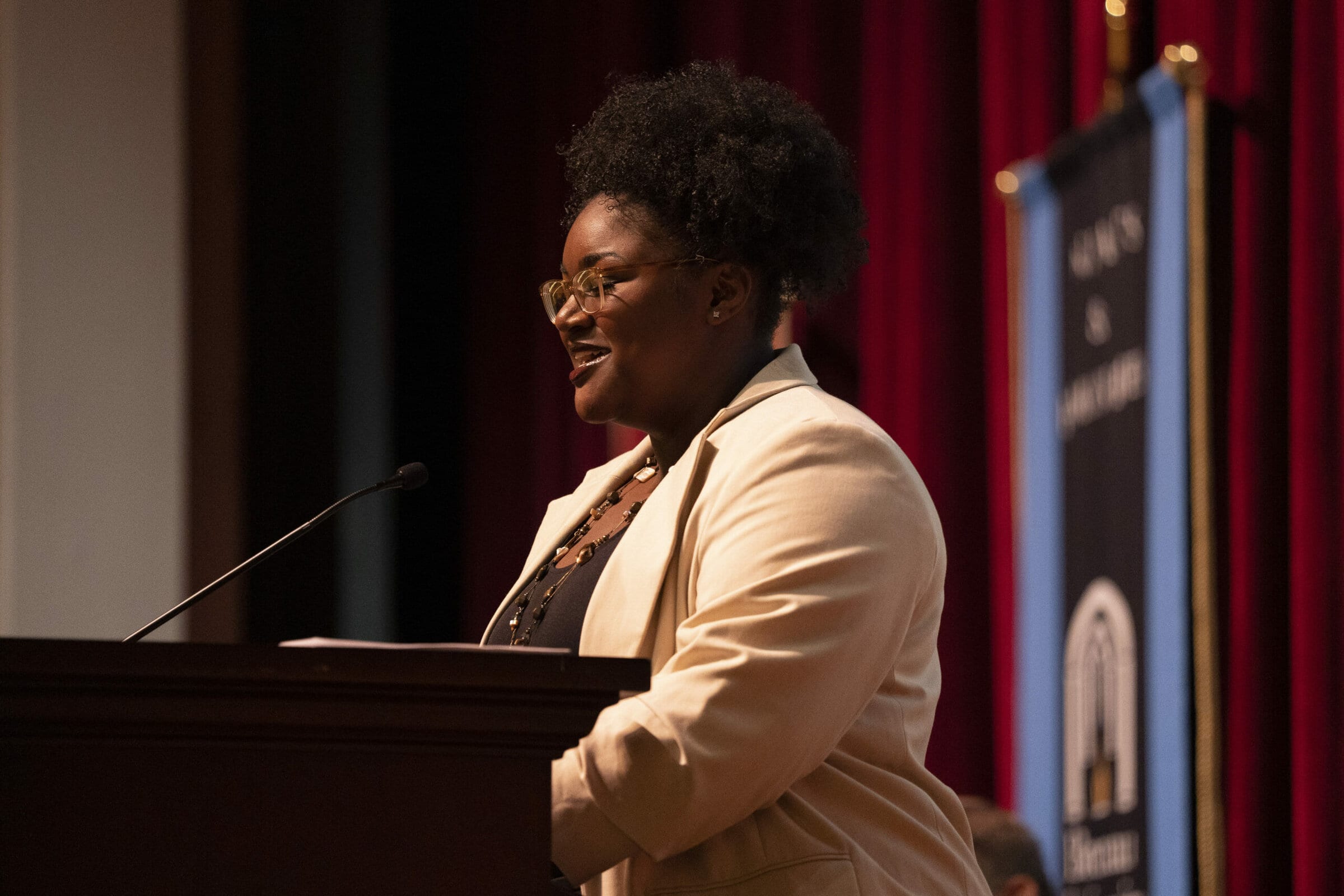 Imani Tornes speaks at the podium at the fall convocation.