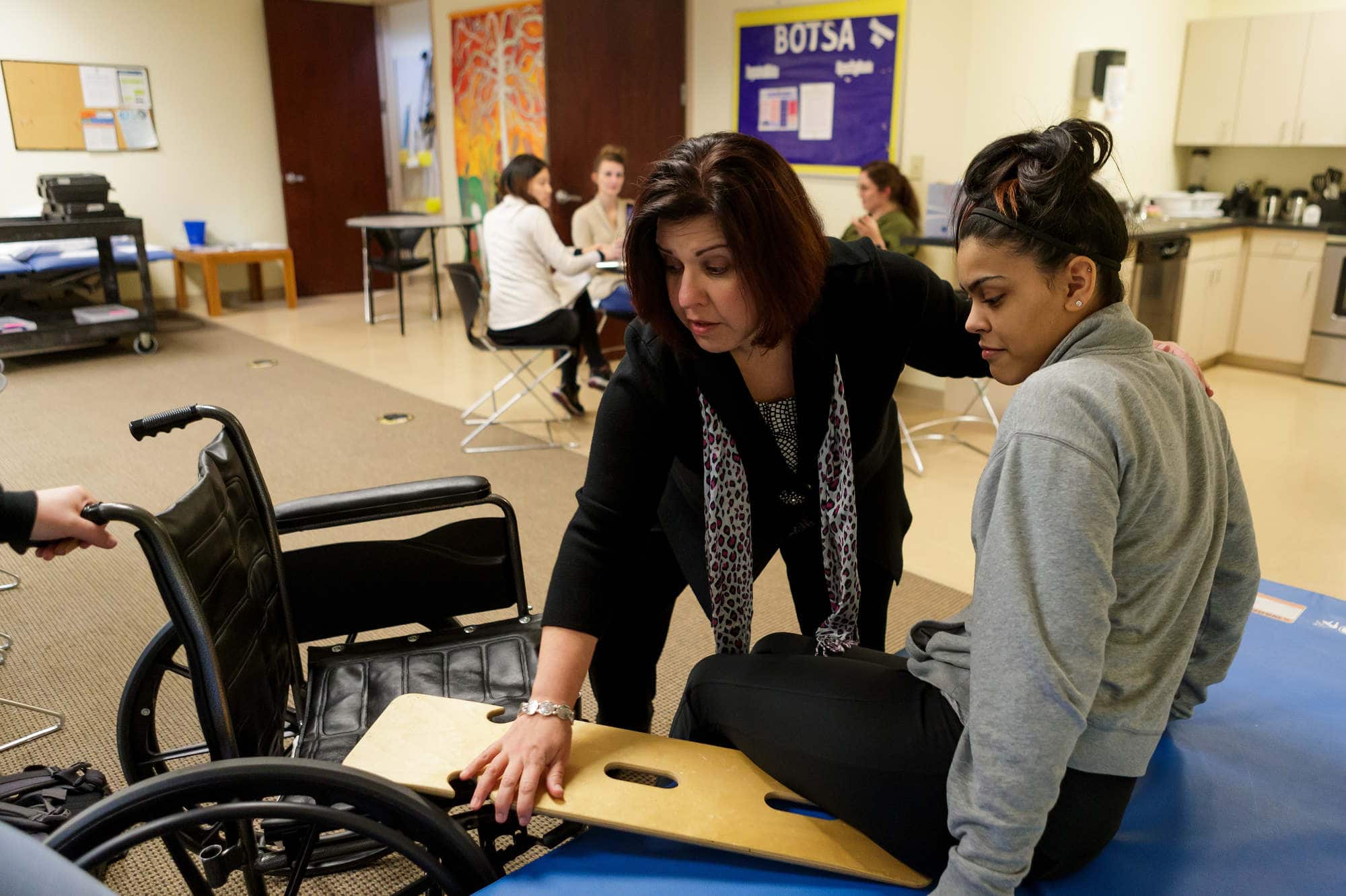 A faculty member instructs occupational therapy students