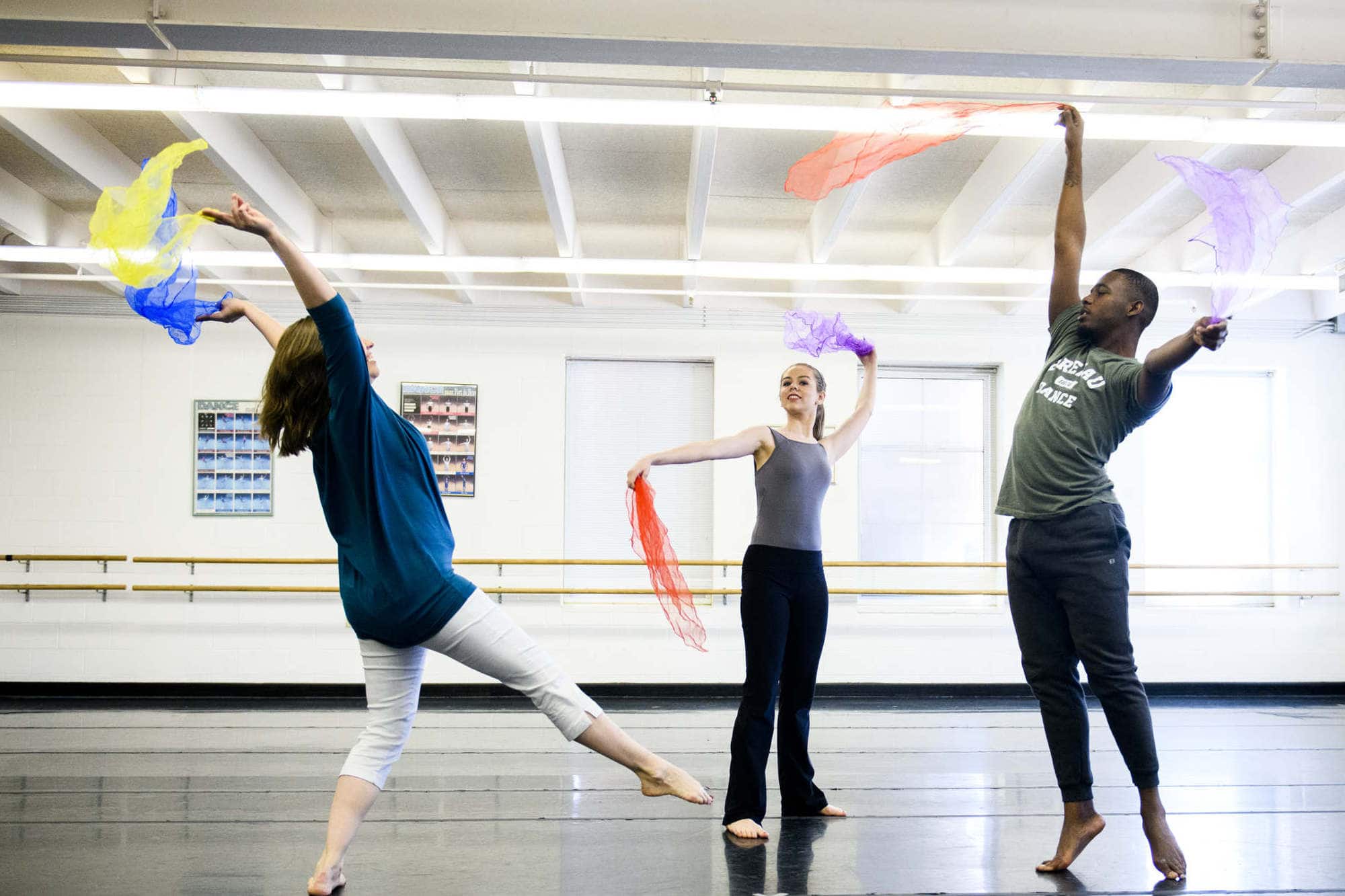 Students and a professor engage in a dance movement therapy activity