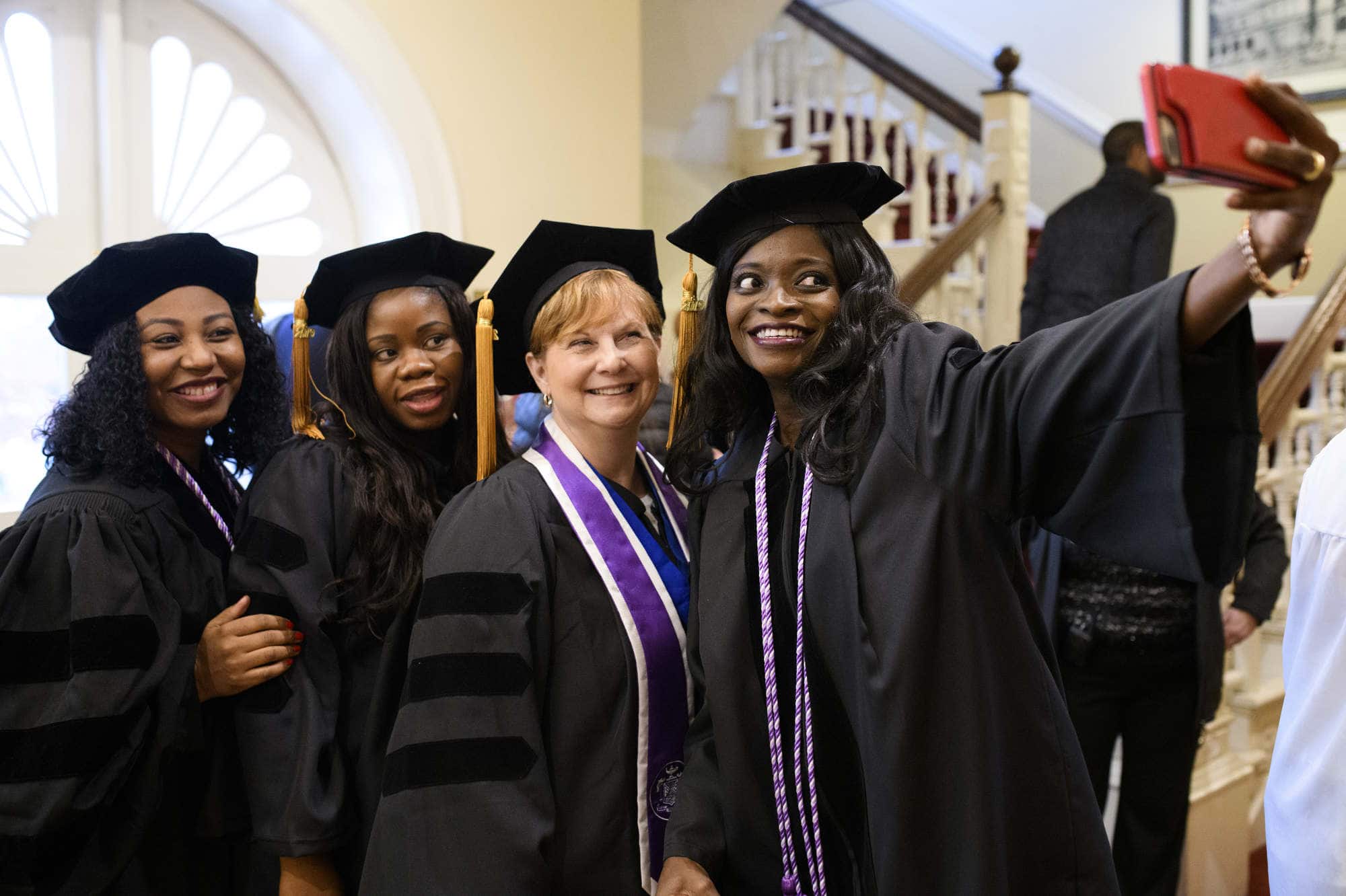 Doctor of Nursing Practice students take a photo at graduation