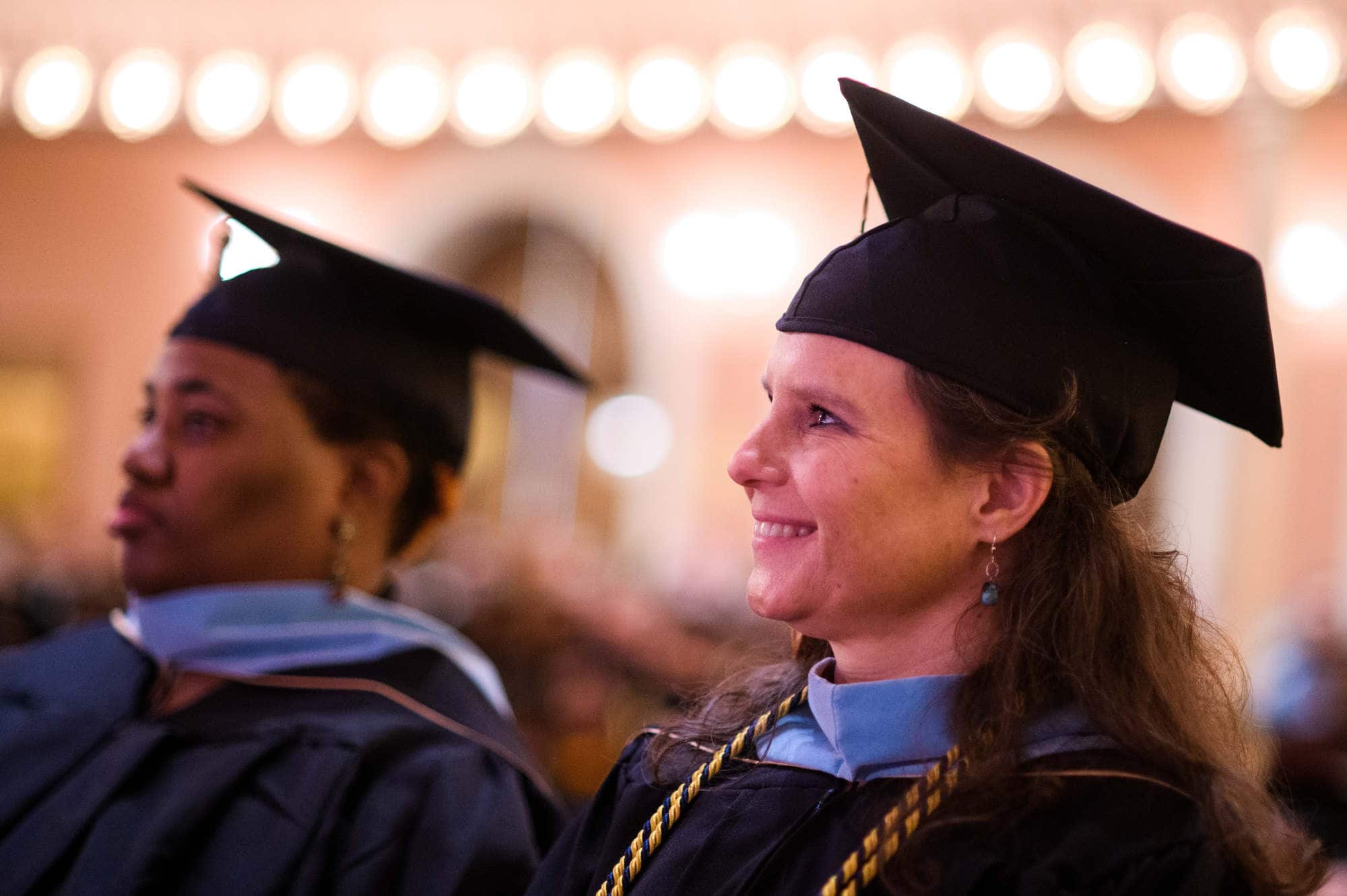 Candidates for the Educational Specialist degree smile as their degree is conferred during the Brenau University Graduate Commencement ceremony