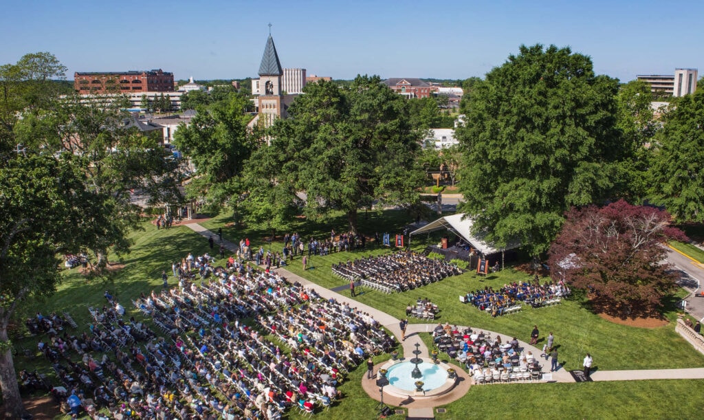 An aerial view of the historic Gainesville campus during a commencement ceremony