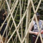 Students looking at the peacock.