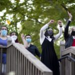 Women's College students stand on the Crow's Nest.