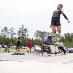 An athlete participates in the long jump.