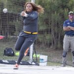 An athlete participates in the hammer throw.