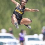 An athlete participating in the long jump.