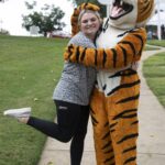 A student hugs HJ, Brenau mascot.