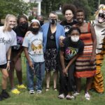 A group of students take a photo with Brenau's mascot, HJ.