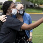 A student takes a selfie with President Anne Skleder.