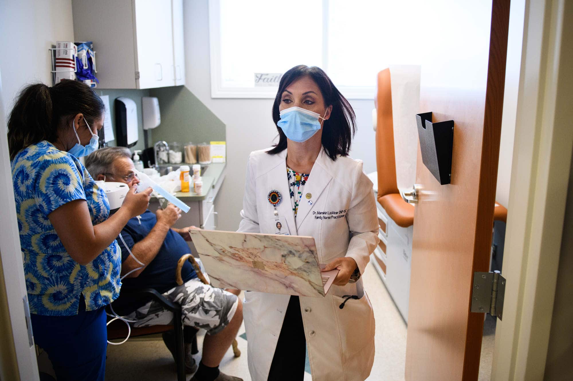 A nurse practitioner sees a patient at her practice