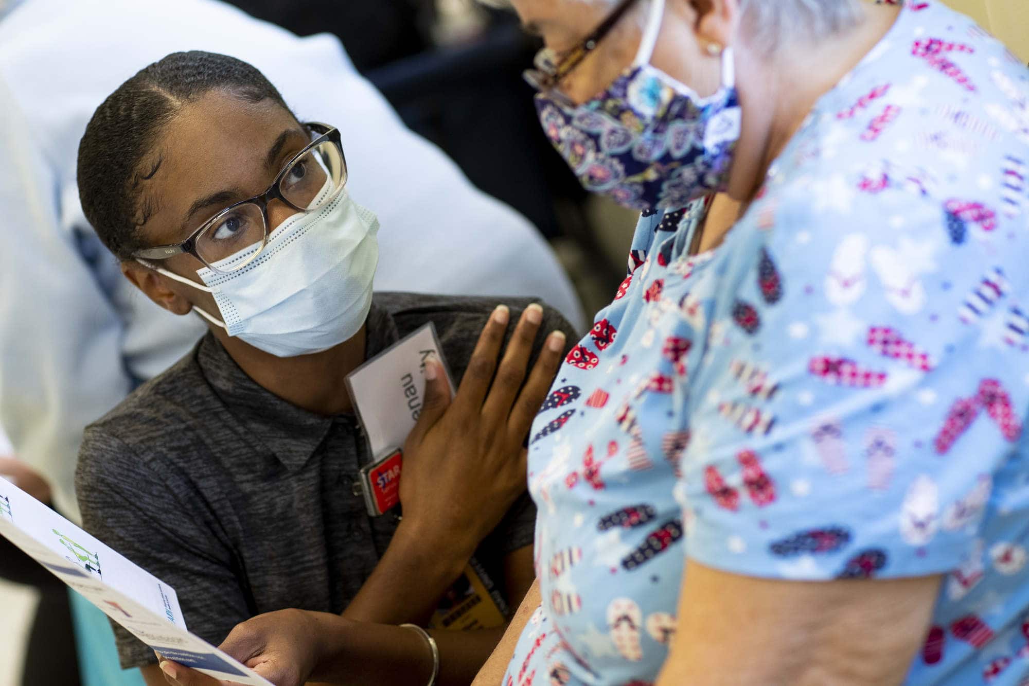 An occupational therapy doctorate student works with a patient