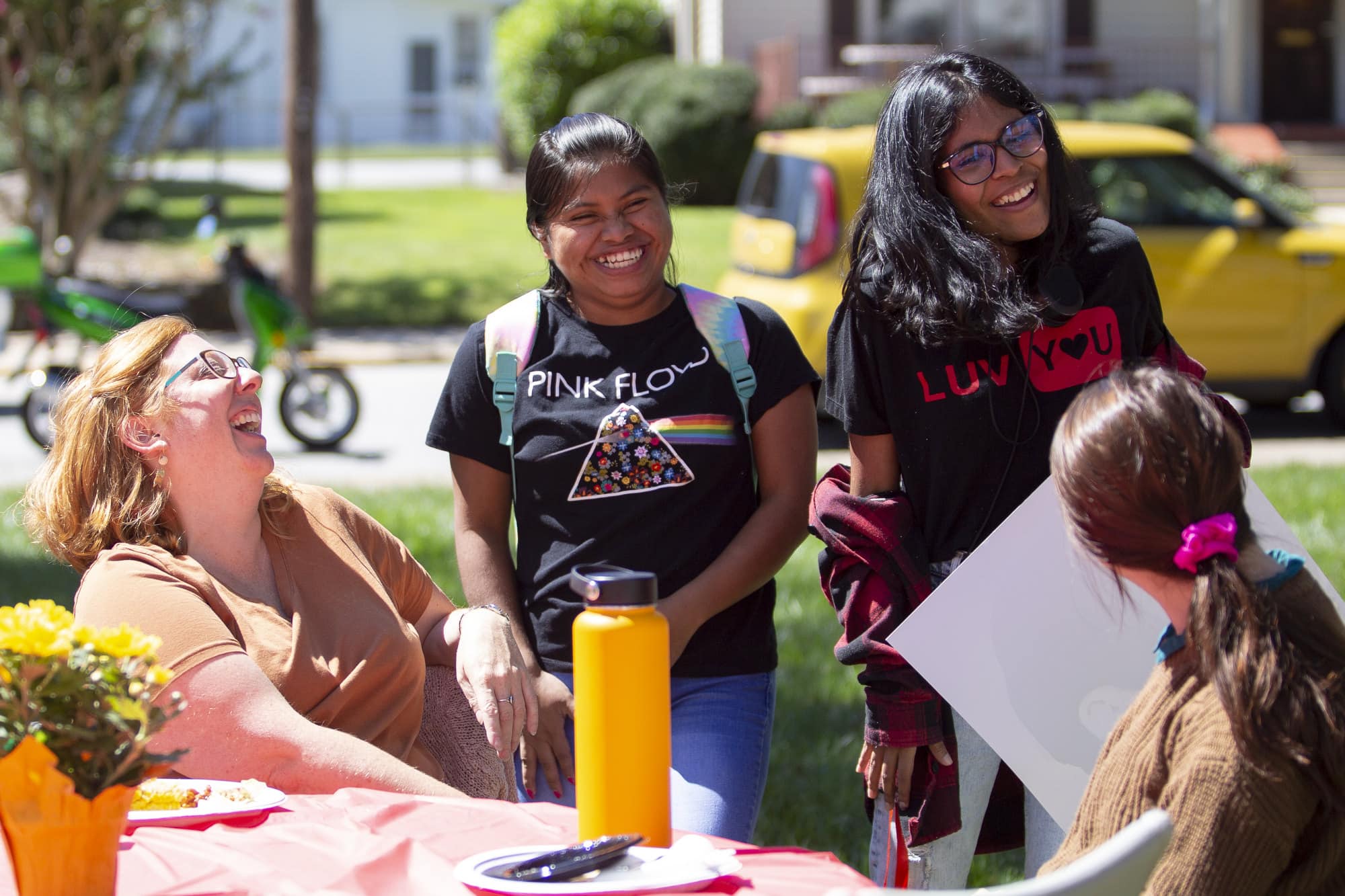 Two international students laugh at a picnic celebrating Brenau's International Friendship Program