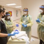 students wearing protective clothing