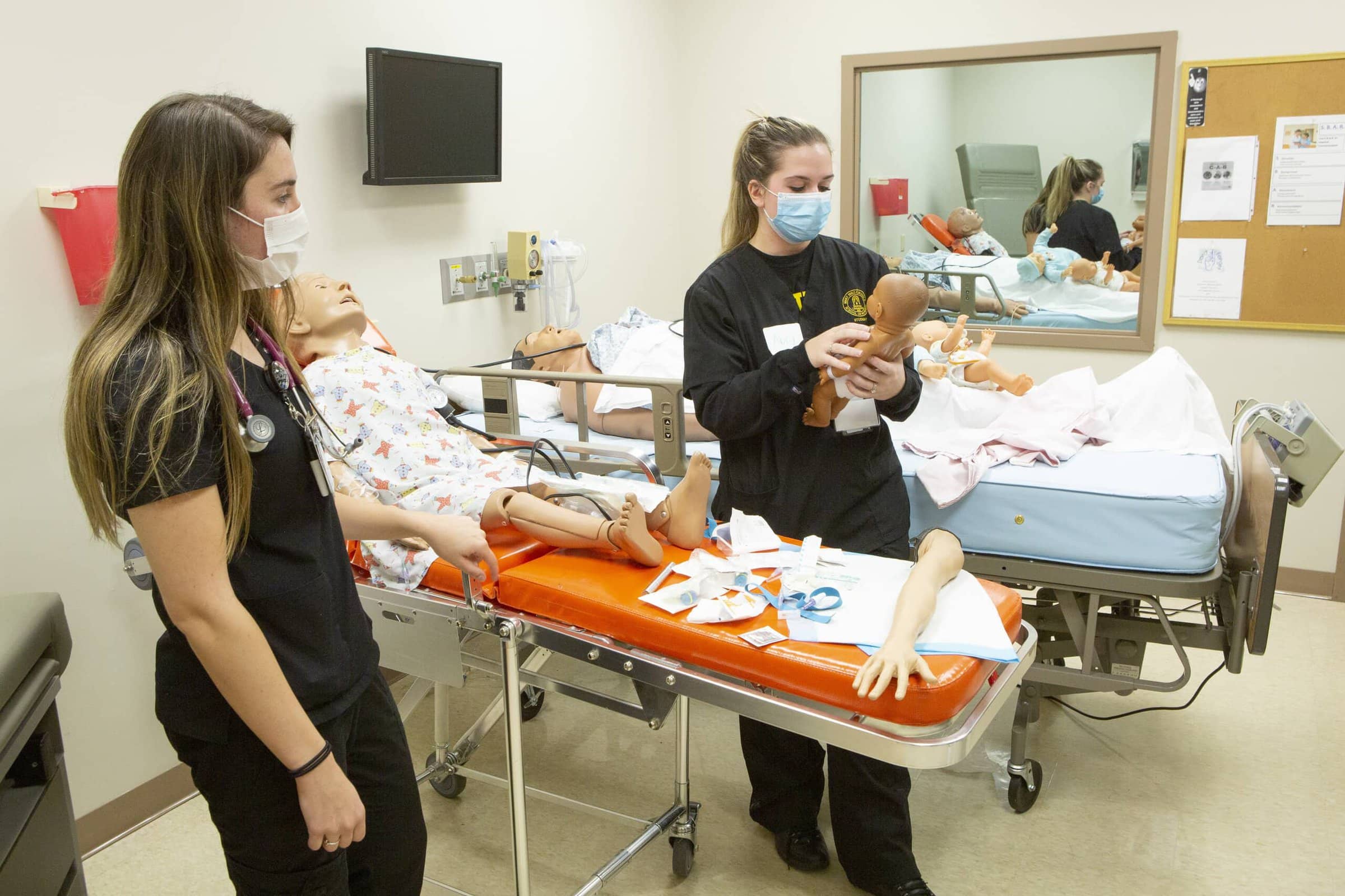 Medical scholar students learn how to take care of babies.