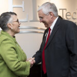 Anne Skleder shakes hands with Tim McDonald