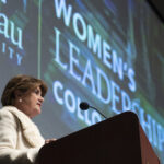 Woman at podium at Women's Leadership Colloquium
