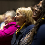 Audience laughing at Women's Leadership Colloquium