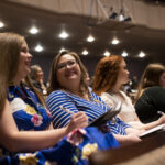 Audience applauding at Women's Leadership Colloquium