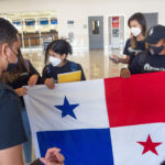Panamanian students hold up Panama's Flag