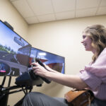 Student trying the driving simulator