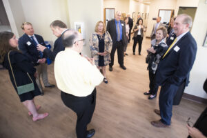 Darby School ribbon-cutting people talking