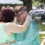Sage Magness celebrates their engagement with their partner, Sheena Hill. Being thrown in the fountain after getting engaged is a Brenau tradition.