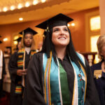 Graduate Taylor Love waits to walk across the stage