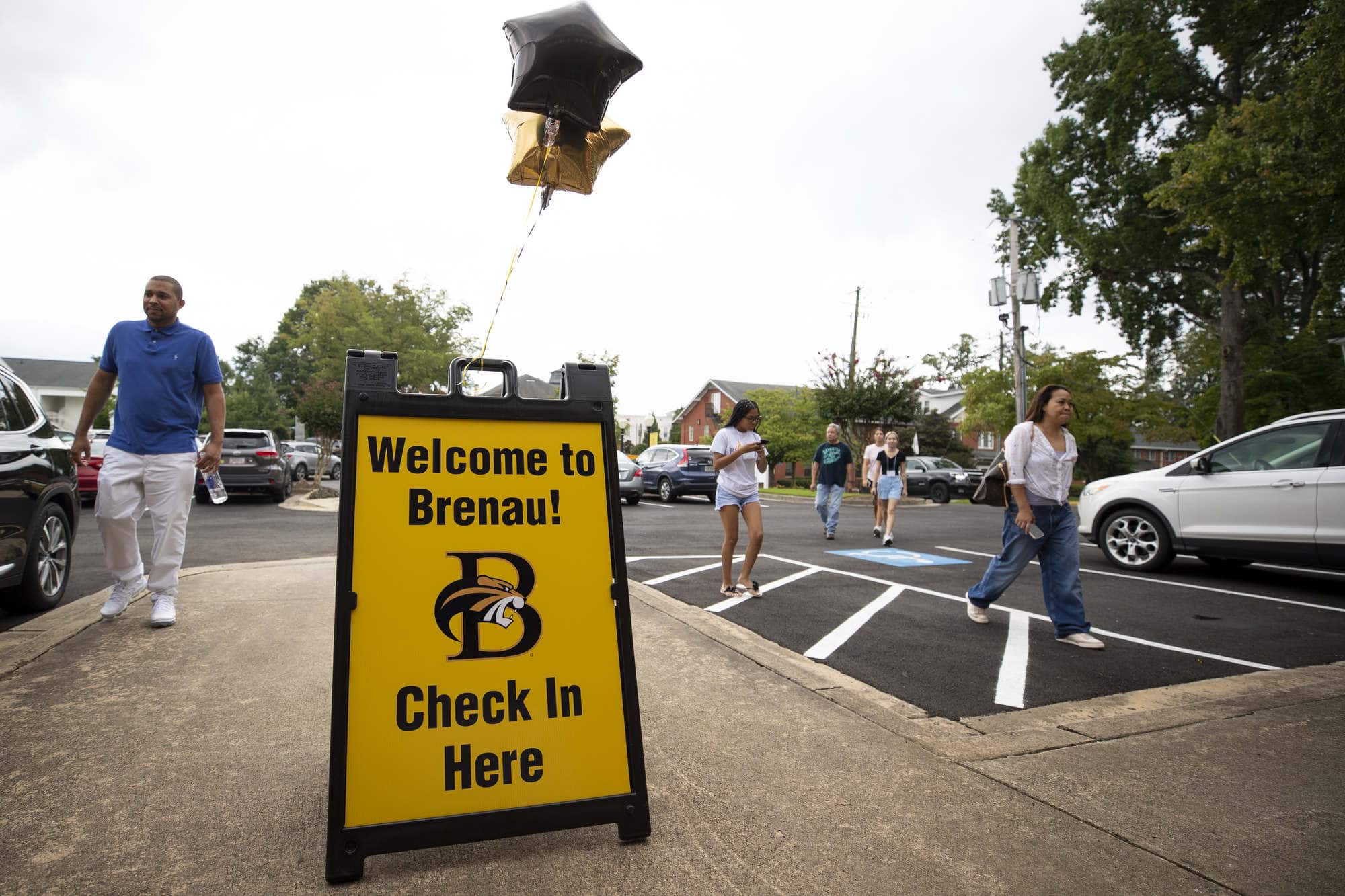 A sign for student check in