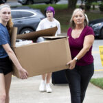 A student and her family move in to the dorms.